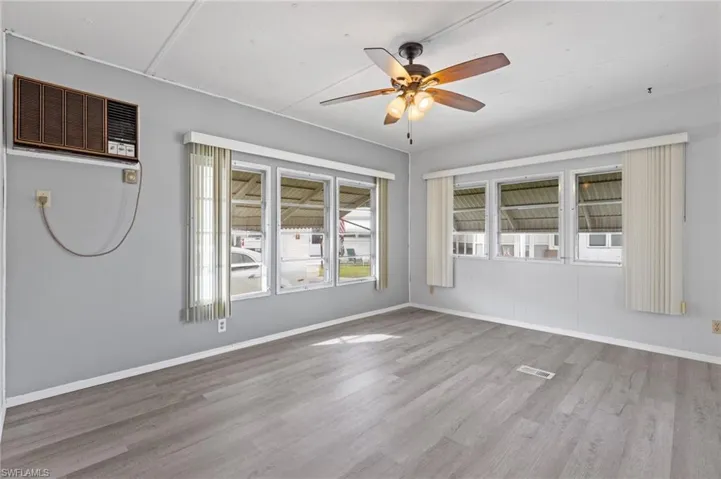 Unfurnished room with light hardwood / wood-style flooring and ceiling fan