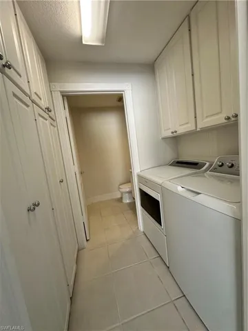 laundry room with plenty of storage cabinets