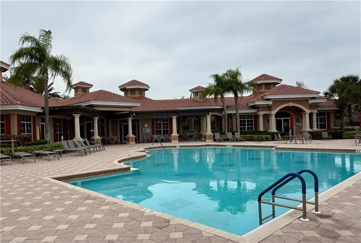 Community pool featuring a patio