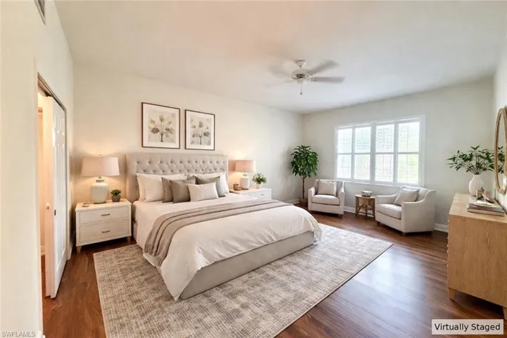 Bedroom featuring dark wood finished floors and ceiling fan