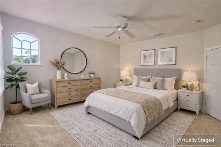 Virtually Staged Second EnSuite featuring Full Bath with Walk In Closet and ceiling fan