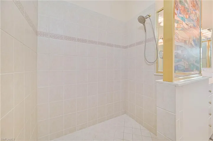 Bathroom with a walk in shower and vanity