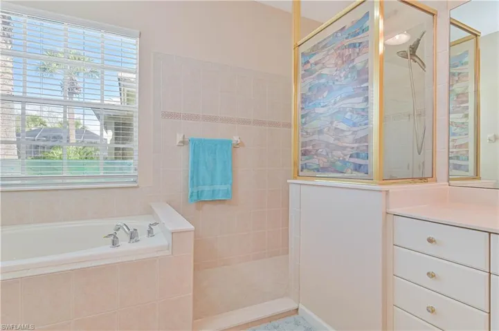 Full bathroom with a garden tub and walk in shower