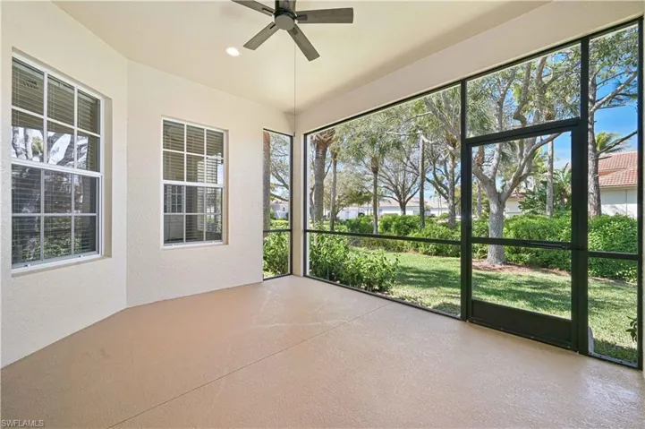 Unfurnished sunroom with ceiling fan