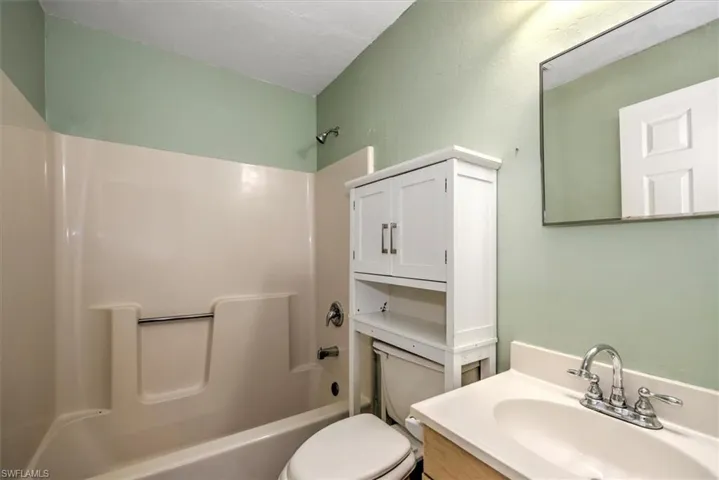 Full bathroom featuring tub / shower combination and vanity