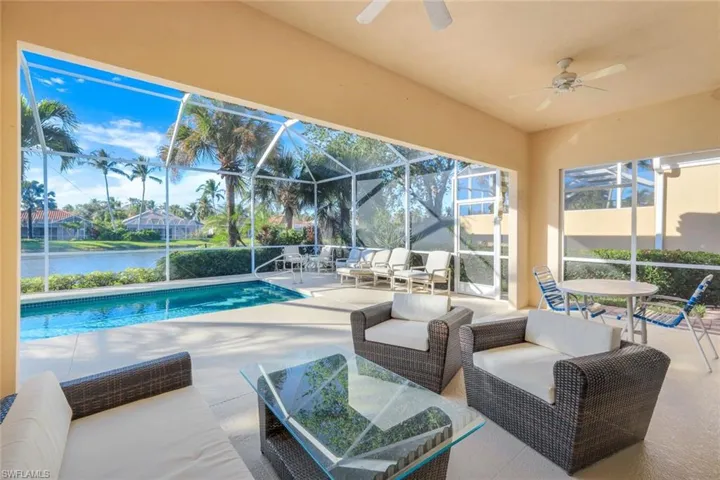 View of pool with outdoor lounge area, ceiling fan, a water view, and a patio