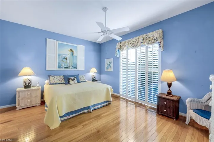 Bedroom featuring ceiling fan and light wood-type flooring