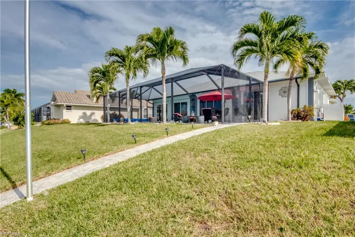 View of yard featuring a lanai