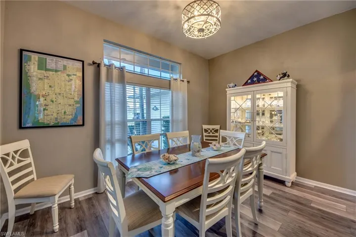 Dining area featuring hardwood / wood-style floors and a notable chandelier