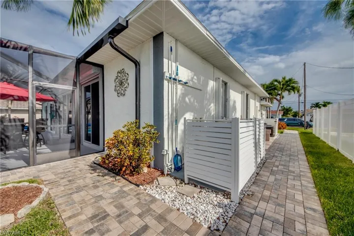 View of property exterior with a lanai