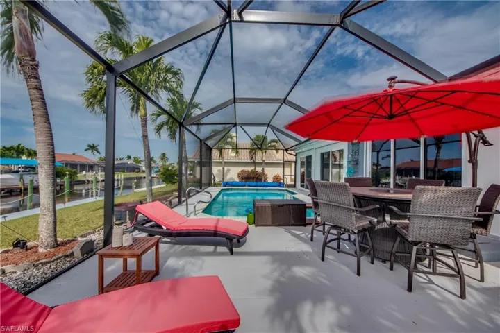 View of patio / terrace with a lanai and a water view