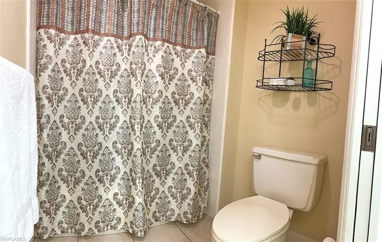Private Master Bathroom featuring Shower/Tub combination and Glass Shower Doors