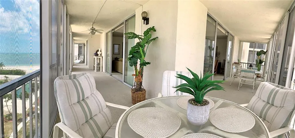 Screened Large Wrap-around Balcony with Hurricane Sliders