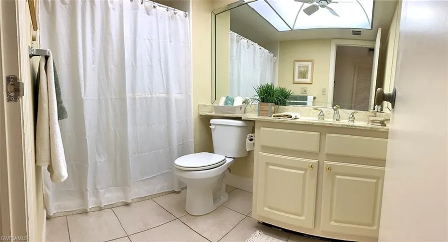 Guest Bathroom with Shower/Tub combination and Glass Shower Doors
