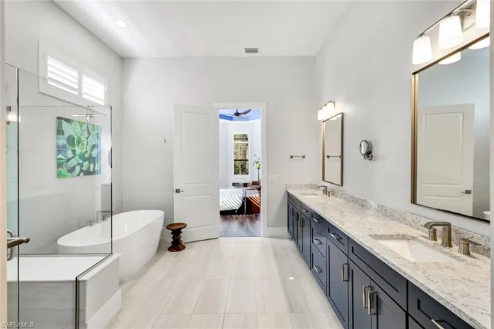 Master bath with dual-sink quartz-topped vanity