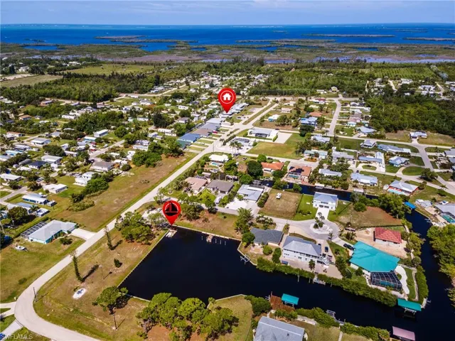 Aerial perspective showcasing a residential neighborhood with canal access