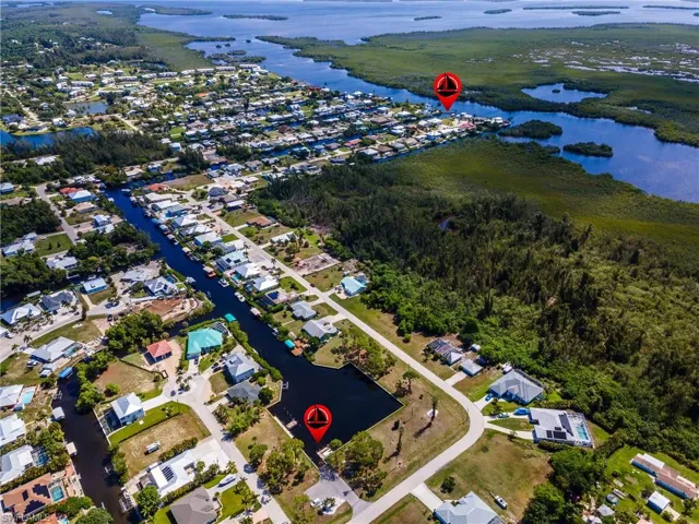 Aerial perspective of a residential area featuring multiple waterways