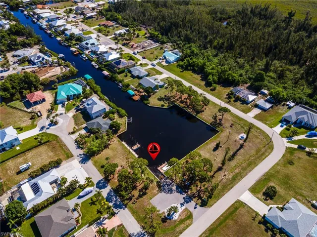 Waterfront property featuring a private boat dock and direct canal access