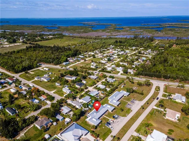 Aerial view showcasing extensive surrounding water bodies and natural vegetation