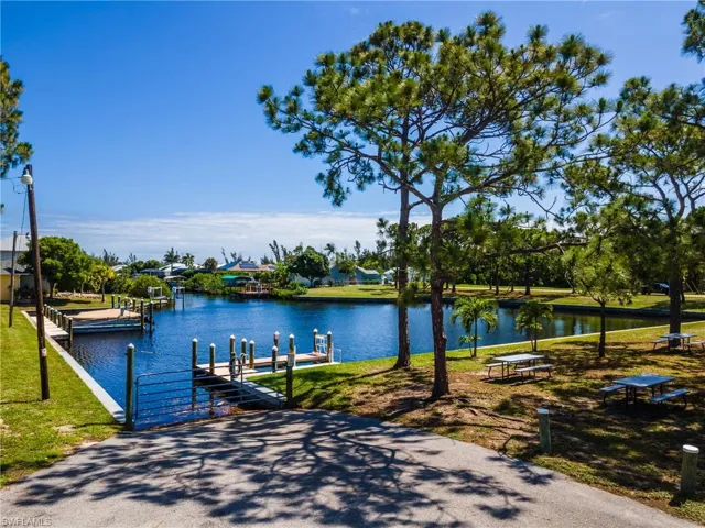 Canal-front property featuring multiple boat slips and docks