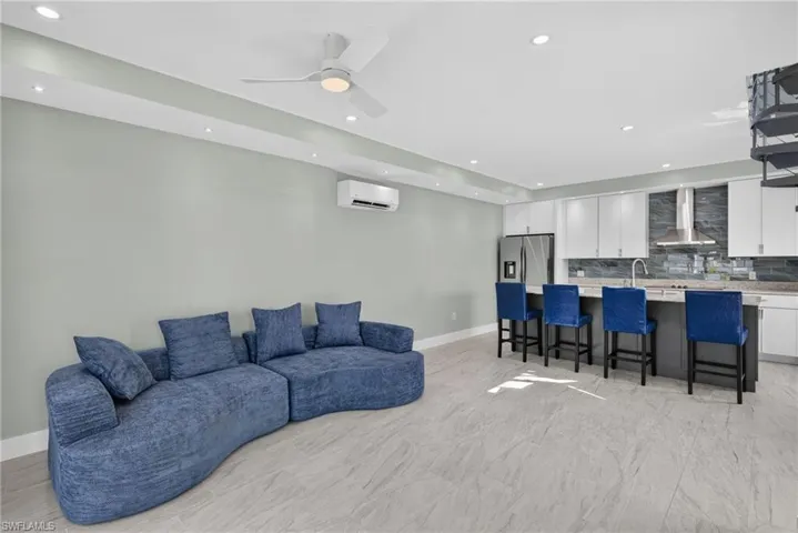 71 Mango Unit 1 Open-concept living area with light-toned flooring and recessed lighting