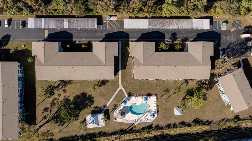 Aerial view of property's location featuring a pool area