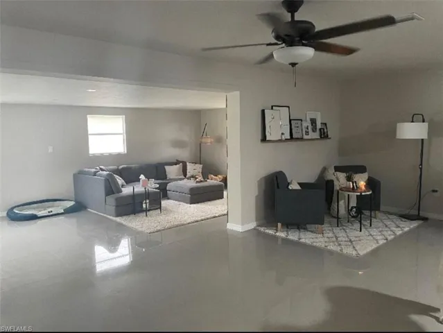 Living room featuring ceiling fan
