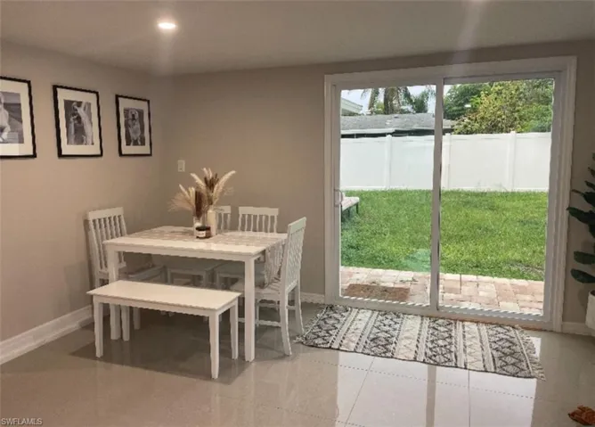 Dining room featuring light tile patterned floors