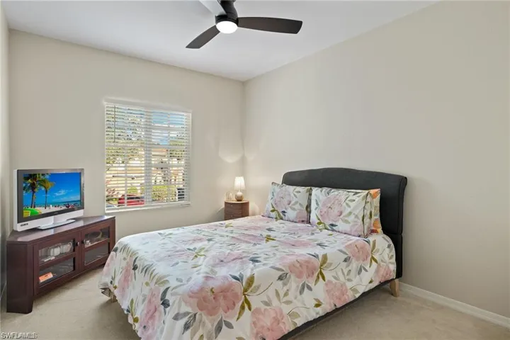 Bedroom featuring carpet and a ceiling fan