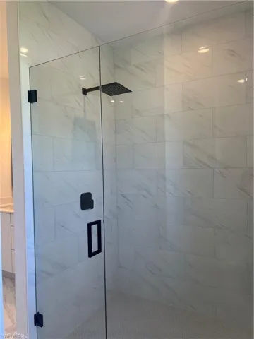 Bathroom with a shower with shower door