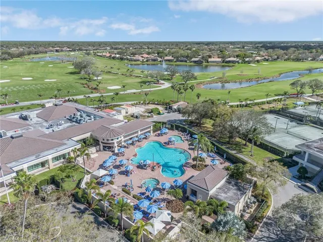 Bird's eye view with a water view and golf course view