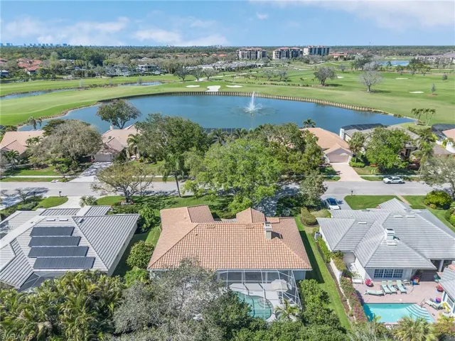 Bird's eye view featuring view of golf course and a water view