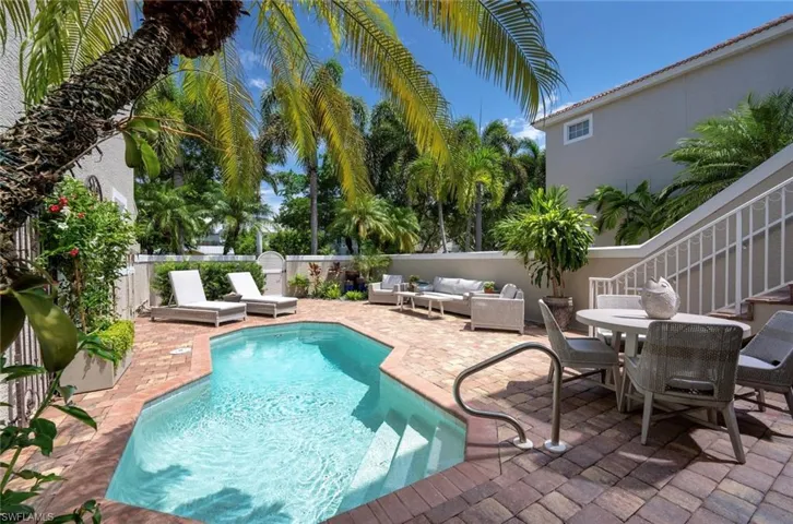 View of swimming pool with outdoor lounge area, a patio area, and a fenced backyard