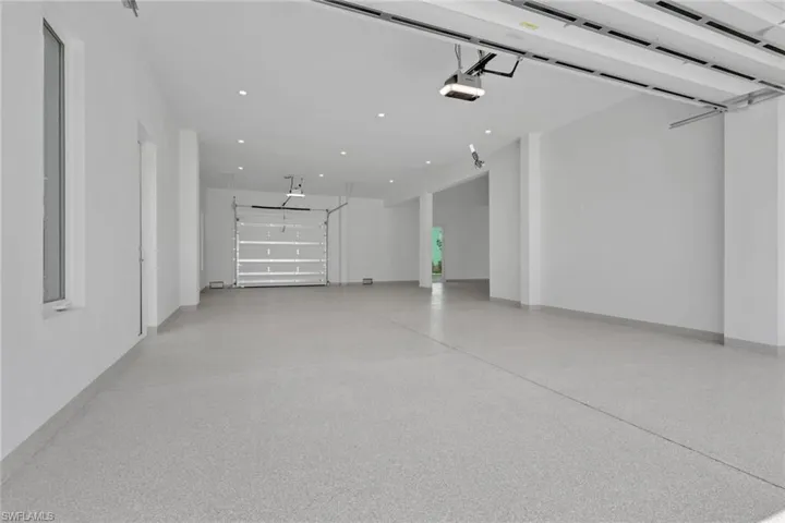 Garage Doors Open to front and back of home