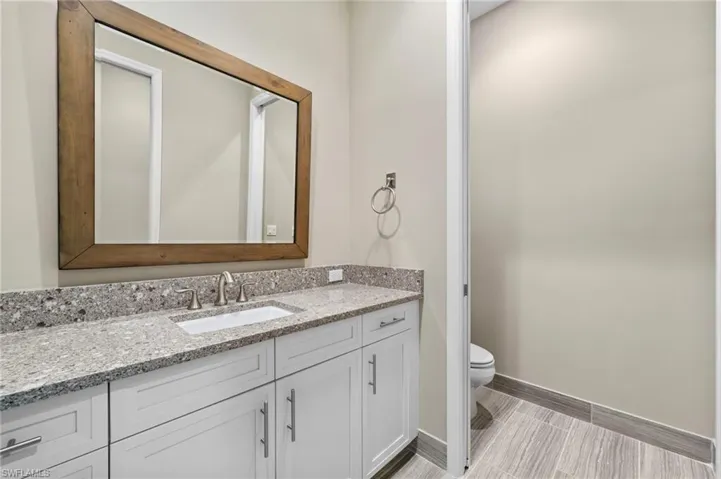 Bathroom featuring toilet and vanity