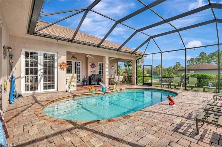 Pool featuring a lanai, a patio, and french doors