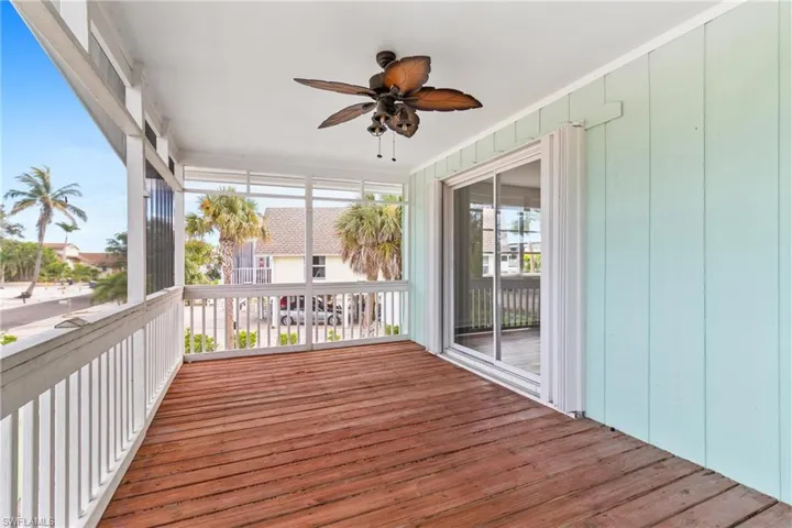 Unfurnished sunroom featuring wood finished floors