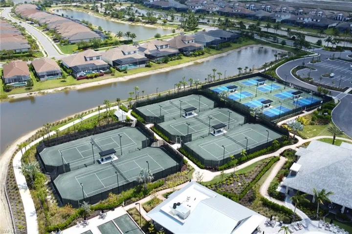 Drone / aerial view with a residential view and a water view