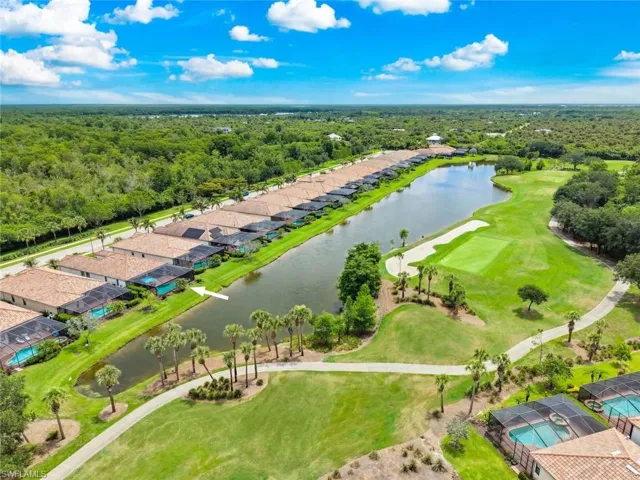 Twin Eagles Home with a screened-in extended lanai with pool, spa and picture screen overlooking the golf course