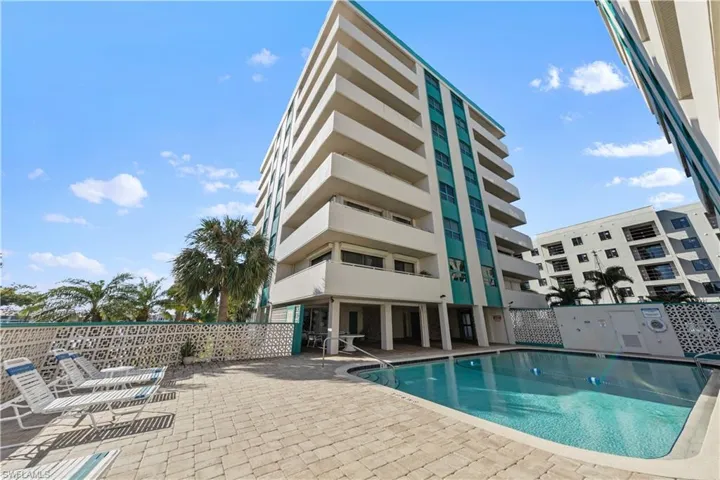 Community pool with a patio