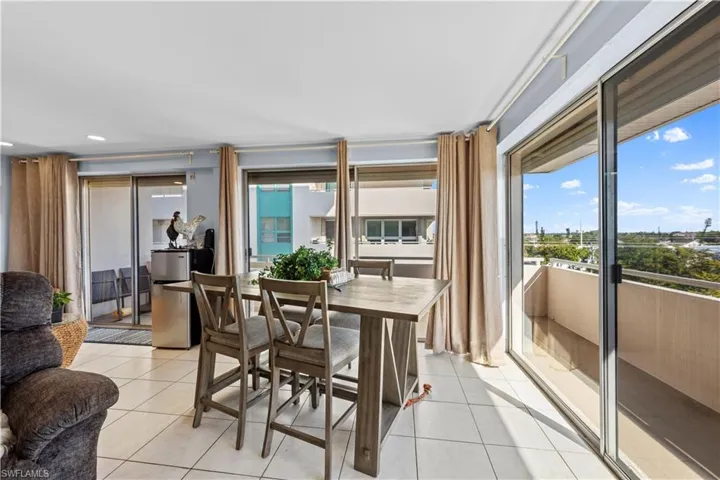 Dining area with light tile patterned floors