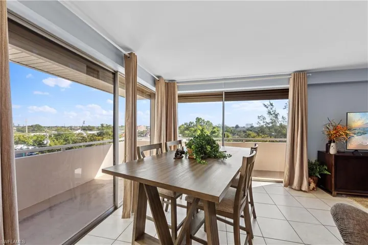 Dining area featuring light tile patterned floors