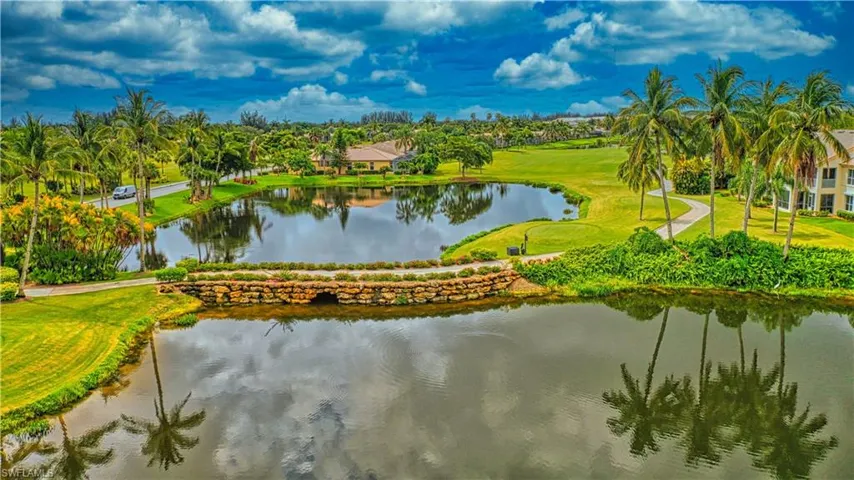 Surrounding community featuring a yard, a water view, and golf course view