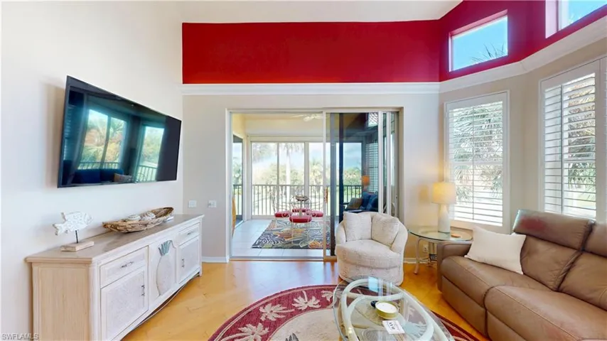 Living room featuring light hardwood flooring and baseboards