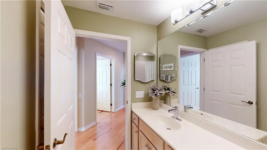 Bathroom featuring vanity and light wood-type flooring