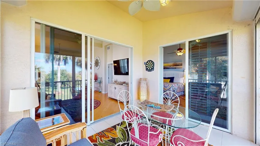 Sunroom / solarium featuring ceiling fan