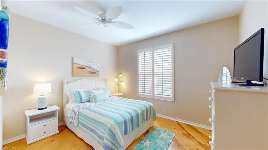 Bedroom featuring light hardwood flooring and a ceiling fan