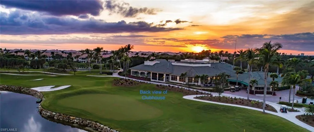Aerial view at dusk of a water view and golf course view