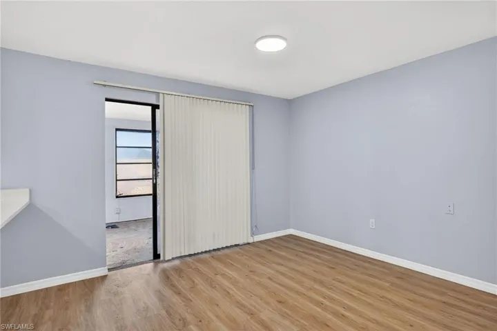 Unfurnished bedroom with light wood-type flooring and baseboards