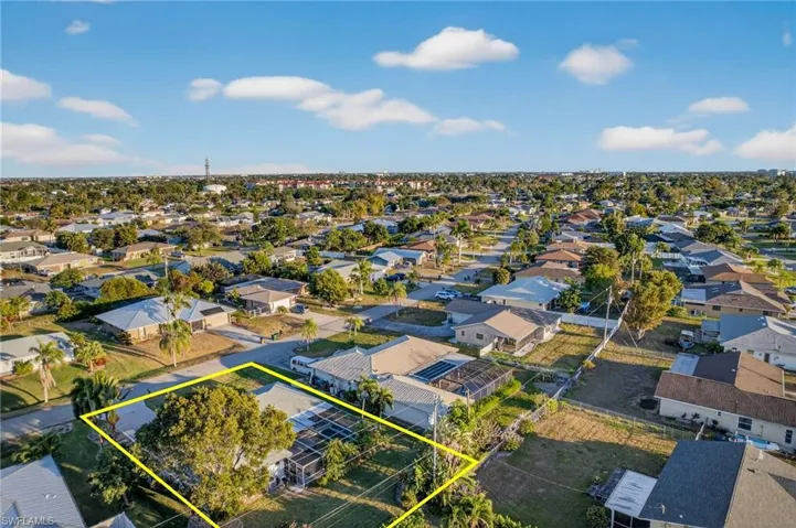 Aerial view of residential area with property boundaries highlighted